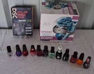 lot 165 image: Dollar Shave Club Unopened Box of Razors, Hair Curlers, and Nail Polish