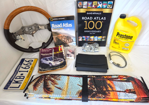 lot 517 image: Rand McNally 100th anniversary road atlas, Mercedes Benz manual case, and assorted automotive related items