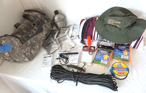 lot 525 image: Assorted survival supplies and gear, new survival spark ferro rod, thermal blankets, emergency water packs and more