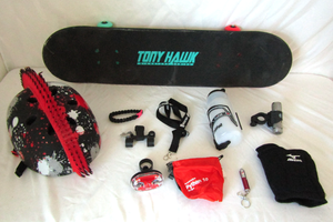lot 532 image: Tony Hawk signature series skateboard, safety helmet, pads and more