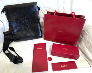 lot 542 image: Gucci Leather double fold purse and Cartier gift bag and boxes