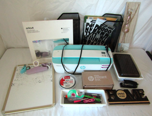 lot 589 image: Cricut paper, HP printer and more as shown