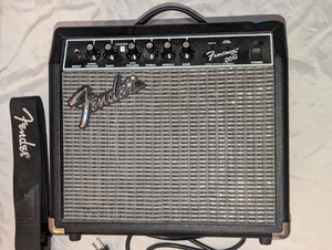 Jackson 4-string electric bass and Fender Frontman 20G amplifier