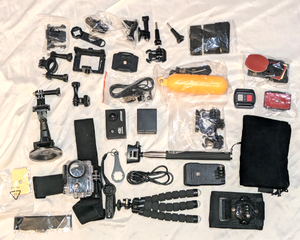 lot 615 image: 4K Action camera and accessories, includes batteries, mounts, and more