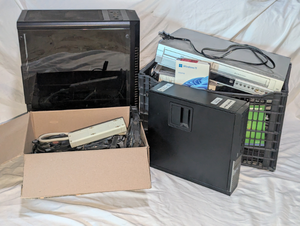 lot 613 image: Assorted computer parts and more, including Dell OptiPlex PC, Zalman PC case, Dell laptop with Windows XP, and assorted computer hardware and hard drives