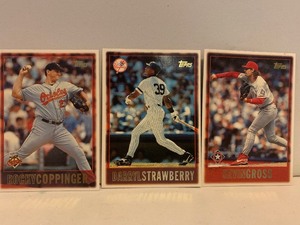lot 128 image: 1997 TOPPS BASEBALL 3-CARD LOT  DARRYL STRAWBERRY YANKEES, ROCKY COPPINGER ORIOLES & KEVIN GROSS