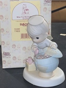 lot 298 image: 1994 PRECIOUS MOMENTS WHAT THE WORLD NEEDS IS LOVE FIGURINE  ENESCO  ORIGINAL BOX