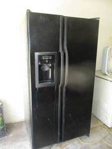 lot 250 image: General Electric Refrigerator - working, water untested not hooked up - 69T x 36W x 33D (GAR)