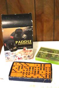 lot 109 image: 1979 Atari Game Paddles, Yellow Dominos, and Card Set. (LR)