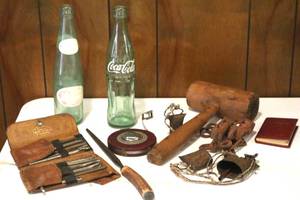 lot 111 image: Dr. Pepper and Coca Cola Bottles, Tape Real, Old Wood Mallet and other items. (LR)