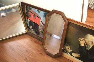 lot 142 image: Fishing by The Covered Bridge by Paul Detlefsen, Grace-Man Praying Over Bread and Hanging Mirror. (DR)
