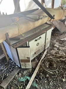 lot 257 image: Clean Out Area - Cast Iron Stove, Roofing Shingles, Old wagon , tricycle .