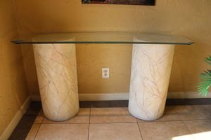 lot 4 image: Glass top entry table - heavy beveled glass, 2 pillars are light weight faux marble design