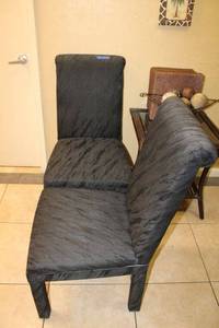 lot 25 image: Two high back black upholstered dining chairs