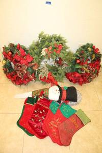 lot 32 image: Christmas wreathes, stockings, and snowman hanging decoration