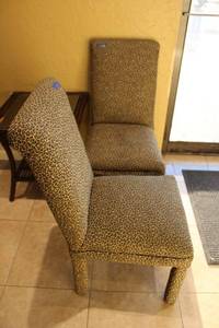 lot 69 image: Two Leopard print upholstered high back dining chairs