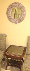 lot 70 image: Dark brown bamboo and rattan side table plus circle wall mirror