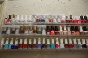 lot 81 image: Nail polish - 3 rows on shelf