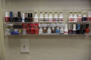 lot 82 image: Nail polish - 2 rows on shelf