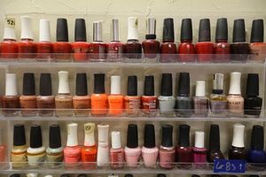 lot 83 image: Nail polish - 3 rows on shelf