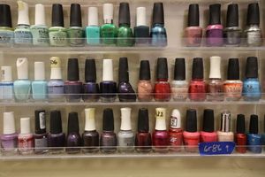 lot 86 image: Nail polish - 3 rows on shelf