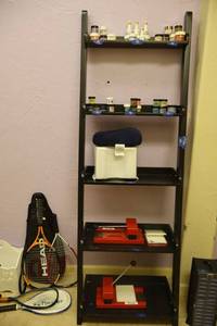 lot 106 image: Black free standing shelf only (not contents)