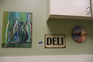 lot 50 image: Painted canvas art, Deli sign, and clock
