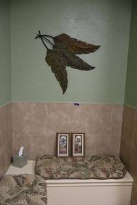 lot 130 image: Metal palm branch wall art, framed palm tree prints and bench cushions