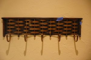 lot 143 image: 2 Wall coat hangers, see photos (bring tools to remove)