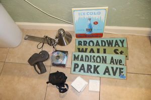 lot 159 image: Metal signs, desk lamp, CDs and Kodak camera