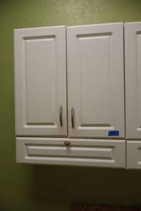 lot 190 image: White wall cabinet (bring tools to remove)