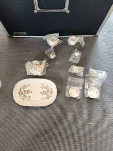 lot 104 image: Porcelain doll tea set