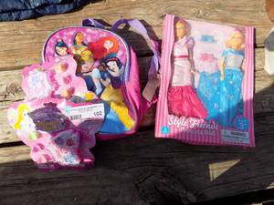 lot 102 image: Fashion doll clothing and a backpack
