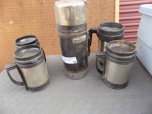 lot 86 image: Stanley thermos and 4 cups