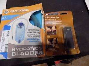 lot 219 image: Hydration bladder and fire starter NIB