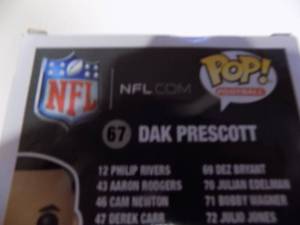 lot 232 image: Funko pop dak Prescott in the box