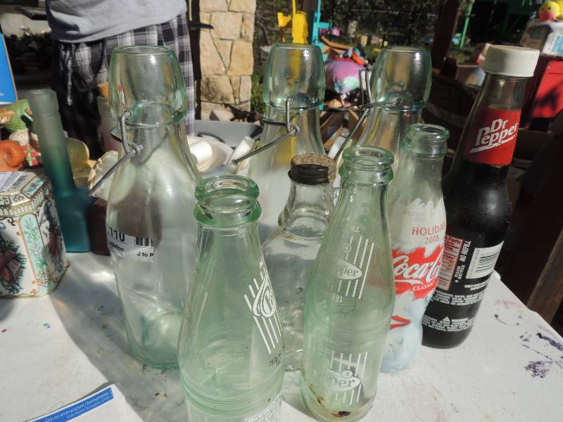lot 110 image: Bottles- Dublin Dr. pepper, Dr. pepper lone star park 5th ann., Coca Cola 2005 and 3 Italian vinegar bottles
