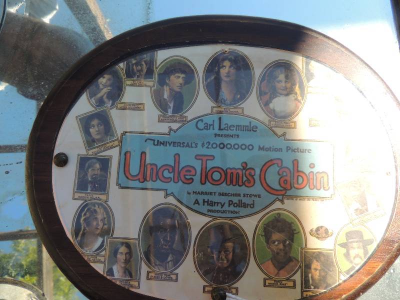 lot 142 image: Antique Uncle Toms Cabin  - CARL LAEMMLE - UNIVERSALS $2,000,000 MOTION PICTURE - framed 1927