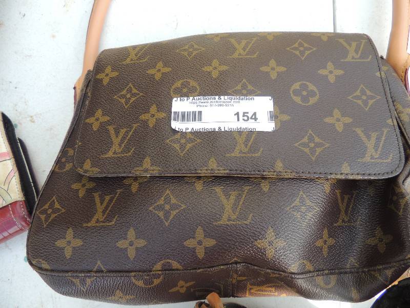 lot 154 image: Louis Vuitton purse ( UNK AUTHENTICIT ),   MONI PURSE