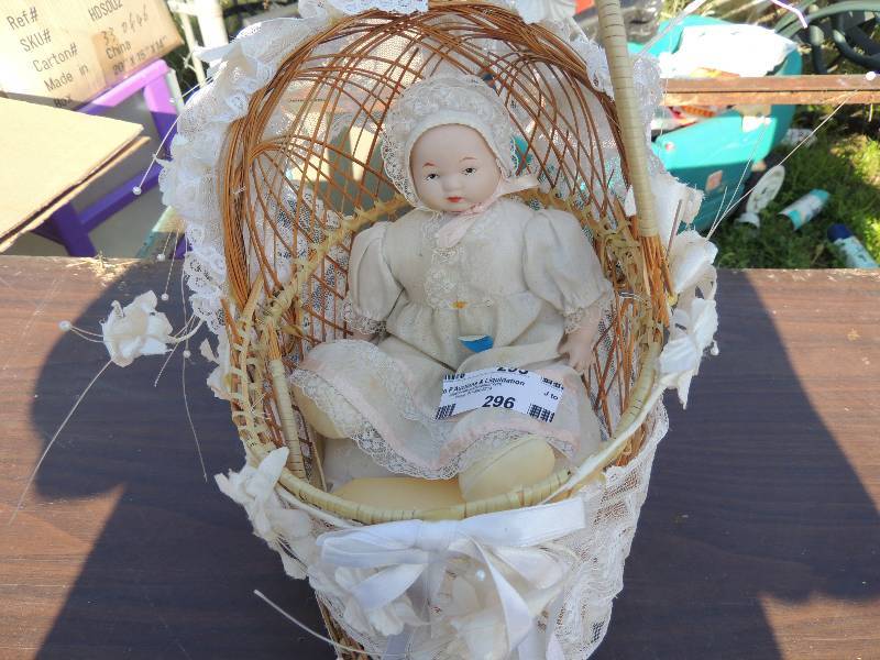 lot 293 image: BISQUE BABY DOLL IN BASSINET