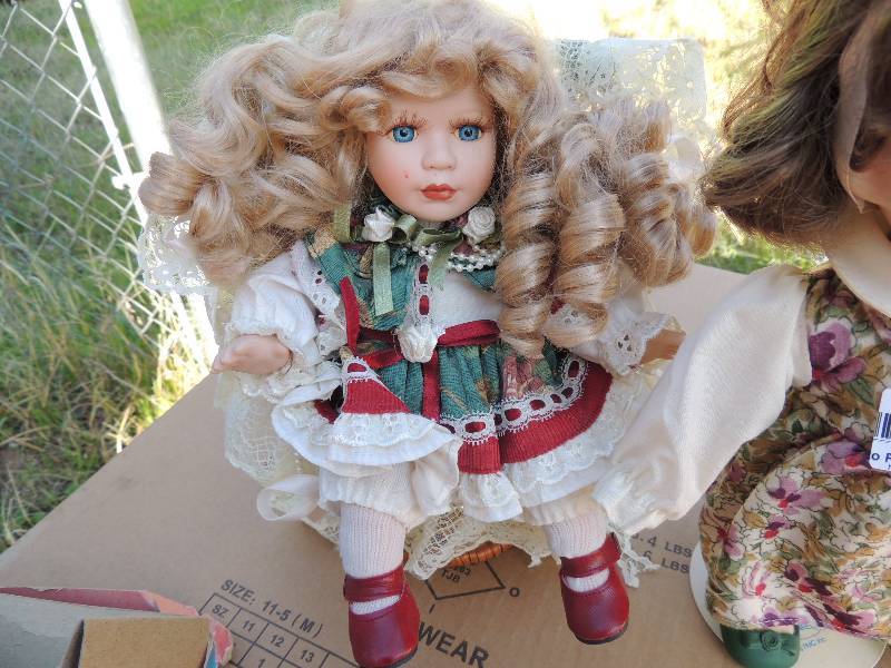 lot 308 image: Baby doll on stand, baby doll in chair