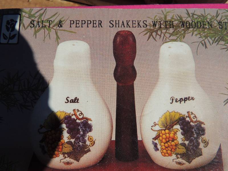 lot 344 image: 2 sets of salt and pepper shakers in wooden stand