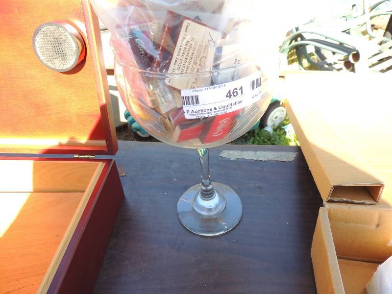 lot 461 image: Giant wine glass full of match books