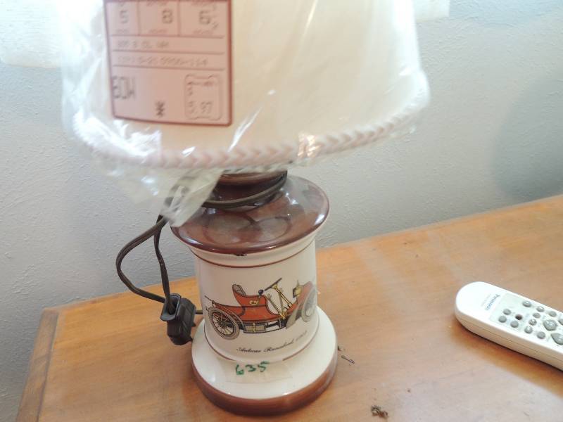 lot 635 image: lamp with shade (auto car runabout 1902 on it)