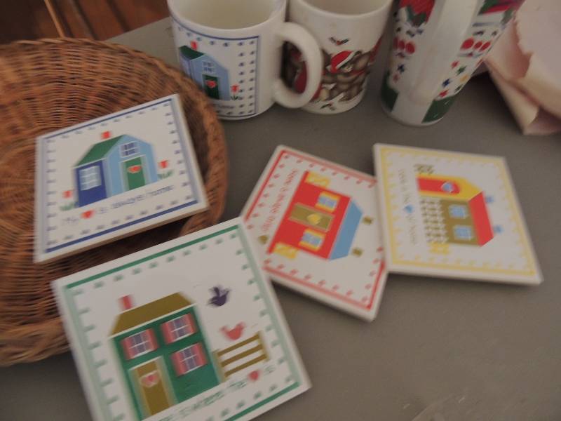 lot 716 image: 3 Christmas mugs and 4 trivets