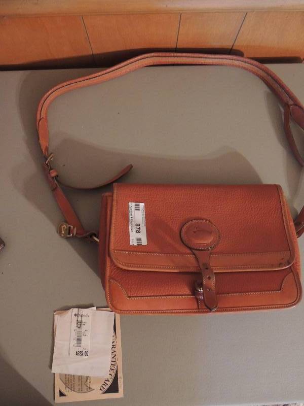 lot 878 image: Dooney and Bourke  leather purse. BRAND NEW. Certificate of authenticity. Price tag from Dillards says $225.00