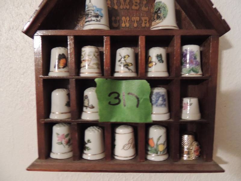 lot 317 image: 24 fine porcelain collectible thimbles displayed in two thimble wall shelves