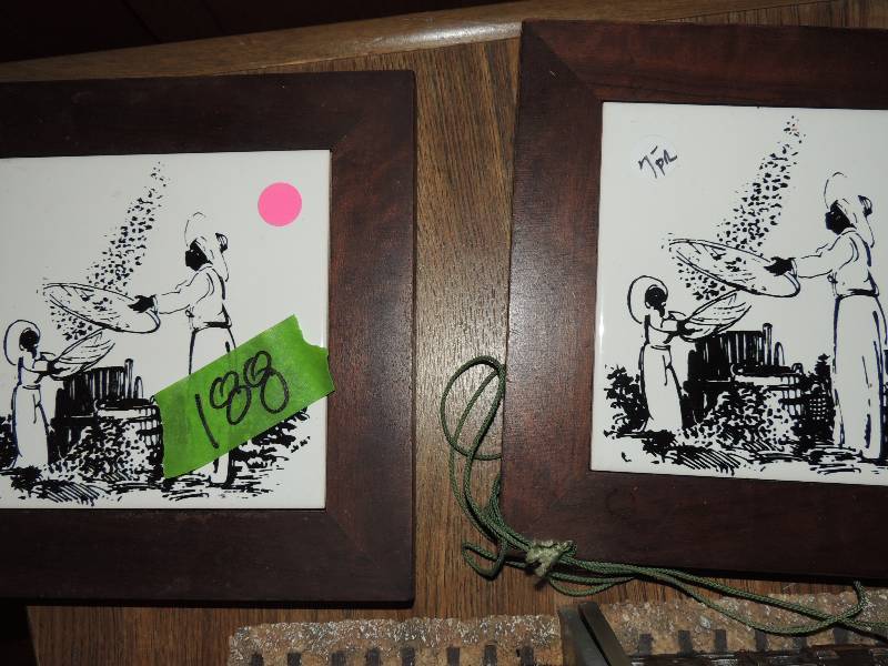 lot 188 image: 2  trivets with adult and child sifting cotton