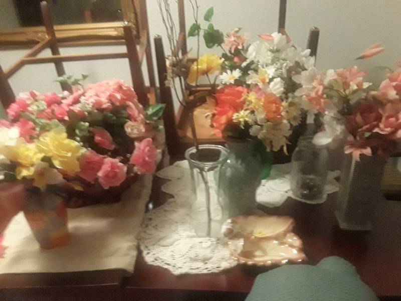 lot 296 image: Pink hand mirror, candle holder, vases and floral arrangements