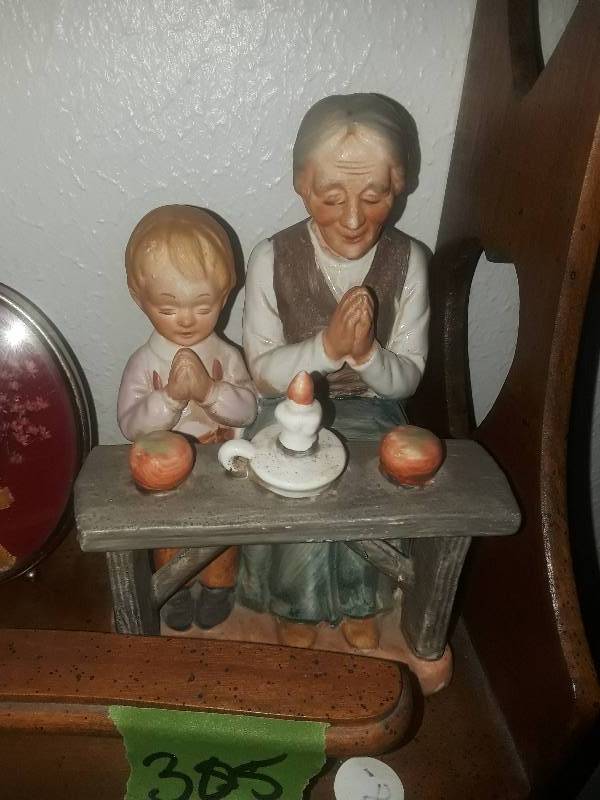 lot 305 image: Ceramic figurine of grandmother and grandchild praying over food